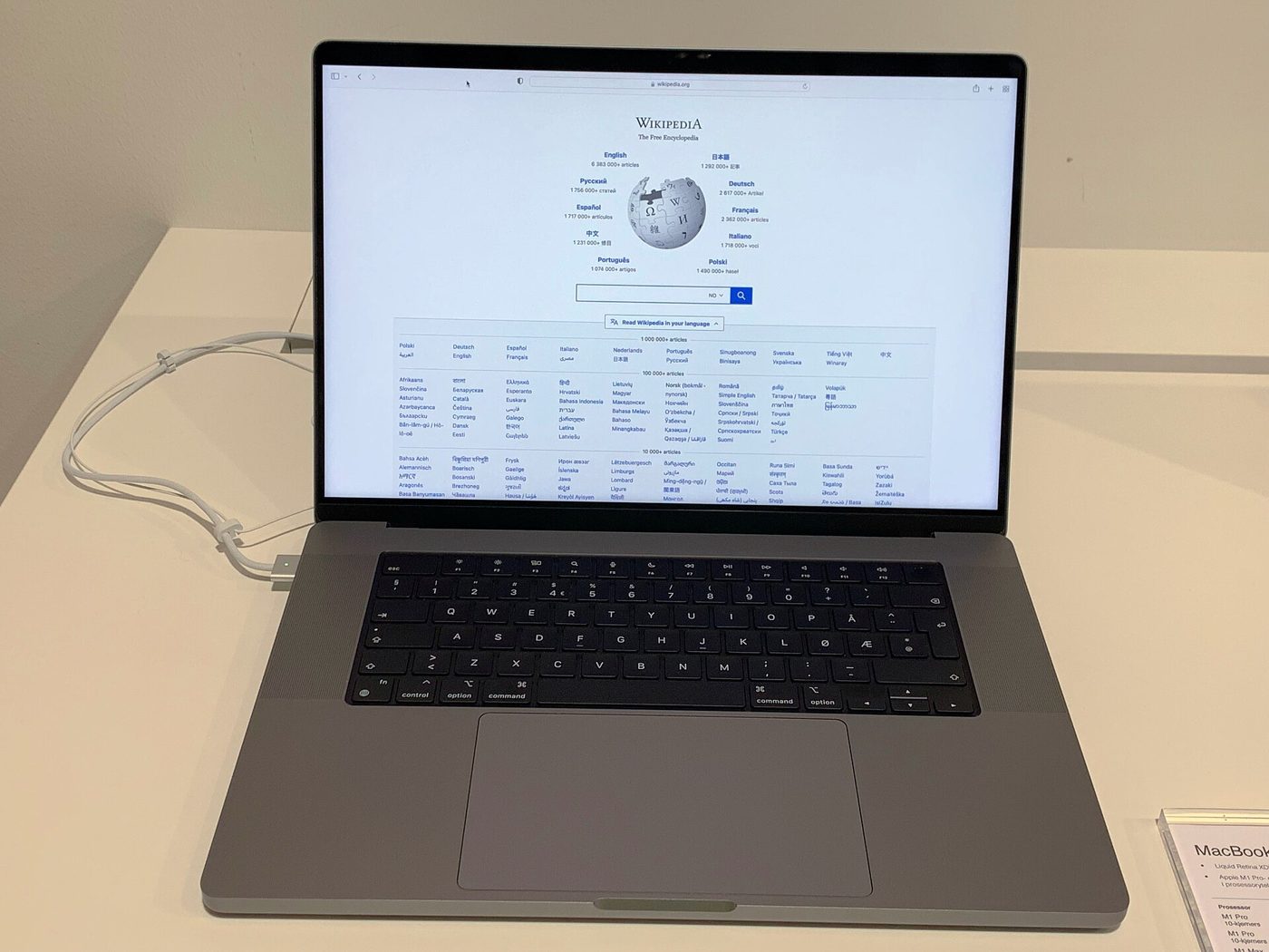 A 16-inch M1 Pro MacBook Pro with a notched display on a store table